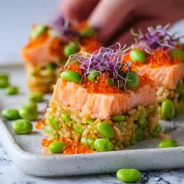 Crispy Rice Topped with Spicy Salmon and Fresh Garnishes Recipe