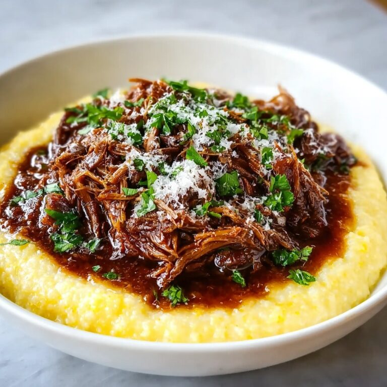 Tender Short Rib Ragu Over Silky Parmesan Mashed Potatoes Recipe